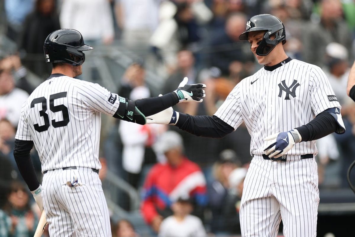 Apr 3, 2026; Bronx, New York, USA; New York Yankees right fielder Aaron Judge (99) celebrates with left fielder Cody Bellinger (35) after hitting a two run home run during the first inning against the Miami Marlins at Yankee Stadium. Mandatory Credit: Vincent Carchietta-Imagn Images