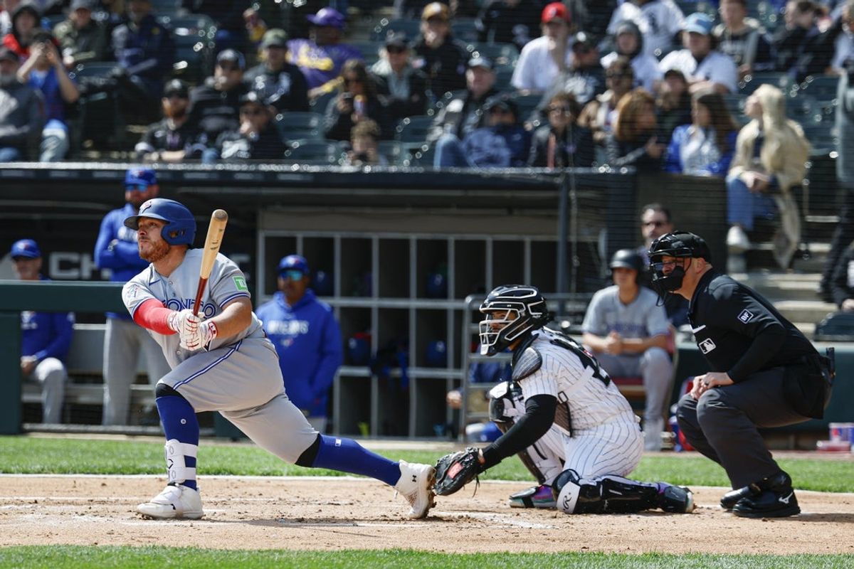 Apr 3, 2026; Chicago, Illinois, USA; Toronto Blue Jays catcher Alejandro Kirk (30) hits an RBI-double against the Chicago White Sox during the second inning at Rate Field. Mandatory Credit: Kamil Krzaczynski-Imagn Images