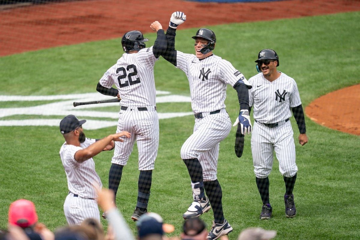 New York Yankees right fielder Aaron Judge (99) celebrates with teammates after hitting a home run during the first inning of the home opener baseball game between the New York Yankees and Miami Marlins at Yankee Stadium in Bronx, NY, Friday, April 3, 2026.