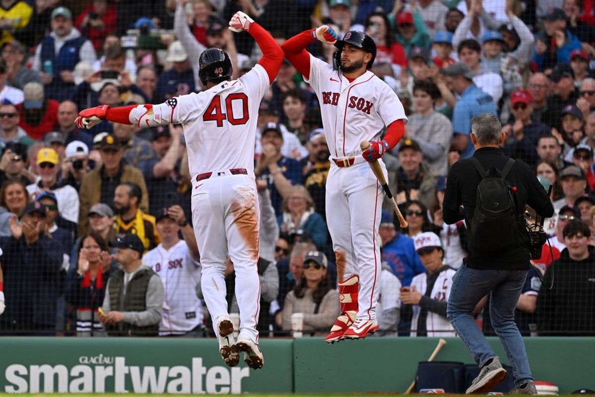 Apr 3, 2026; Boston, Massachusetts, USA; Boston Red Sox first baseman Willson Contreras (40) celebrates his a home run with pitching coach Andrew Bailey (53) during the sixth inning against the San Diego Padres at Fenway Park. Mandatory Credit: Eric Canha-Imagn Images