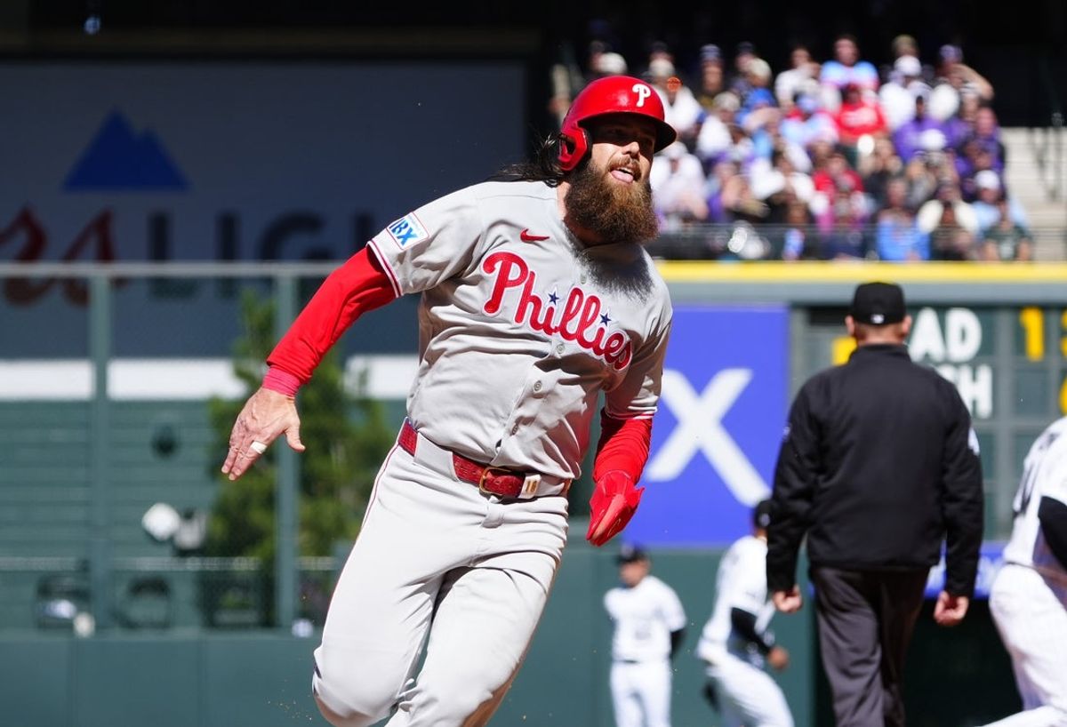 Apr 3, 2026; Denver, Colorado, USA; Philadelphia Phillies center fielder Brandon Marsh (16) heads to third in the second inning against the Colorado Rockies at Coors Field. Mandatory Credit: Ron Chenoy-Imagn Images