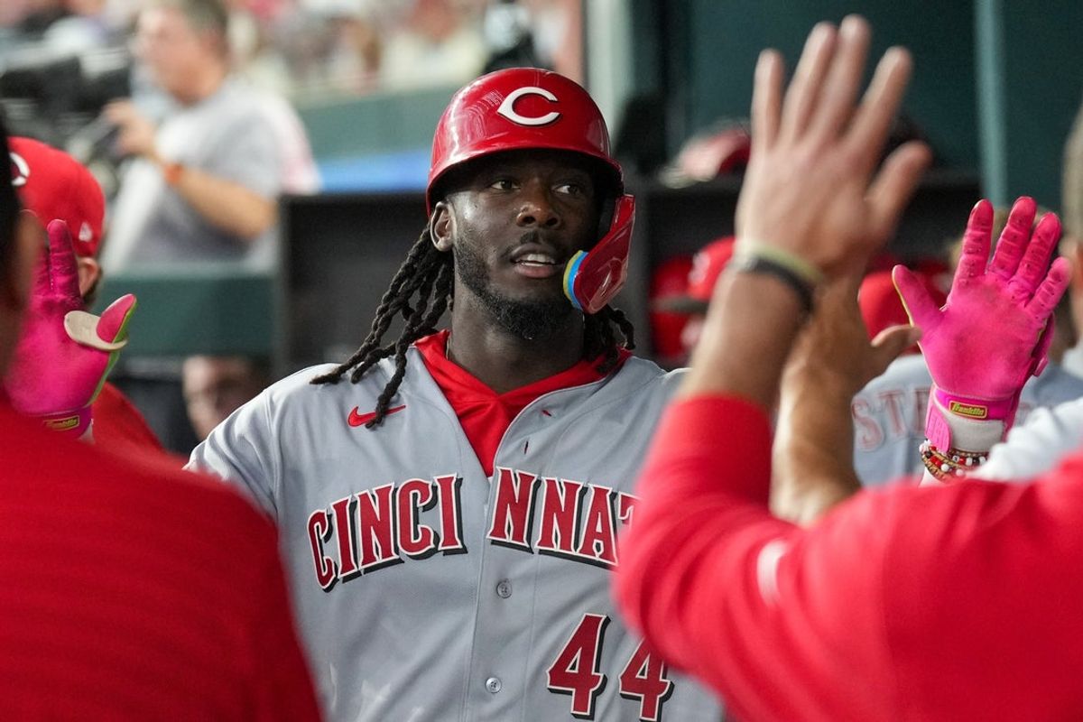 Apr 3, 2026; Arlington, Texas, USA; Cincinnati Reds shortstop Elly de la Cruz (44) celebrates his home run with teammates against the Texas Rangers at Globe Life Field. Mandatory Credit: Jim Cowsert-Imagn Images