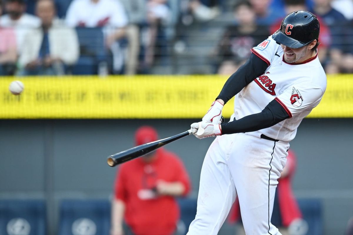 Apr 3, 2026; Cleveland, Ohio, USA; Cleveland Guardians designated hitter Chase DeLauter (24) hits an RBI single during the fifth inning against the Chicago Cubs at Progressive Field. Mandatory Credit: Ken Blaze-Imagn Images