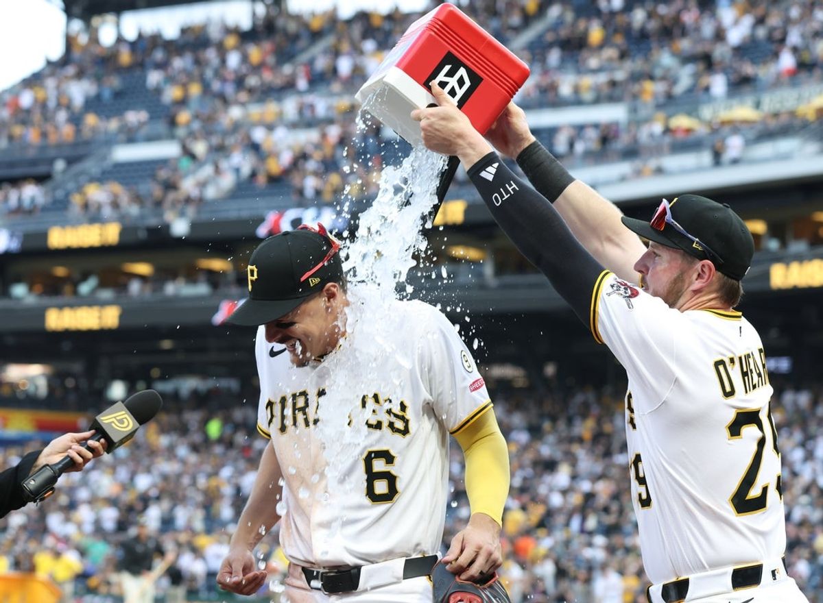 Apr 3, 2026; Pittsburgh, Pennsylvania, USA;  Pittsburgh Pirates left fielder Ryan O'Hearn (29) dumps water on Konnor Griffin (6) after Griffin made his major league debut with an RBI double against the Baltimore Orioles at PNC Park. Mandatory Credit: Charles LeClaire-Imagn Images