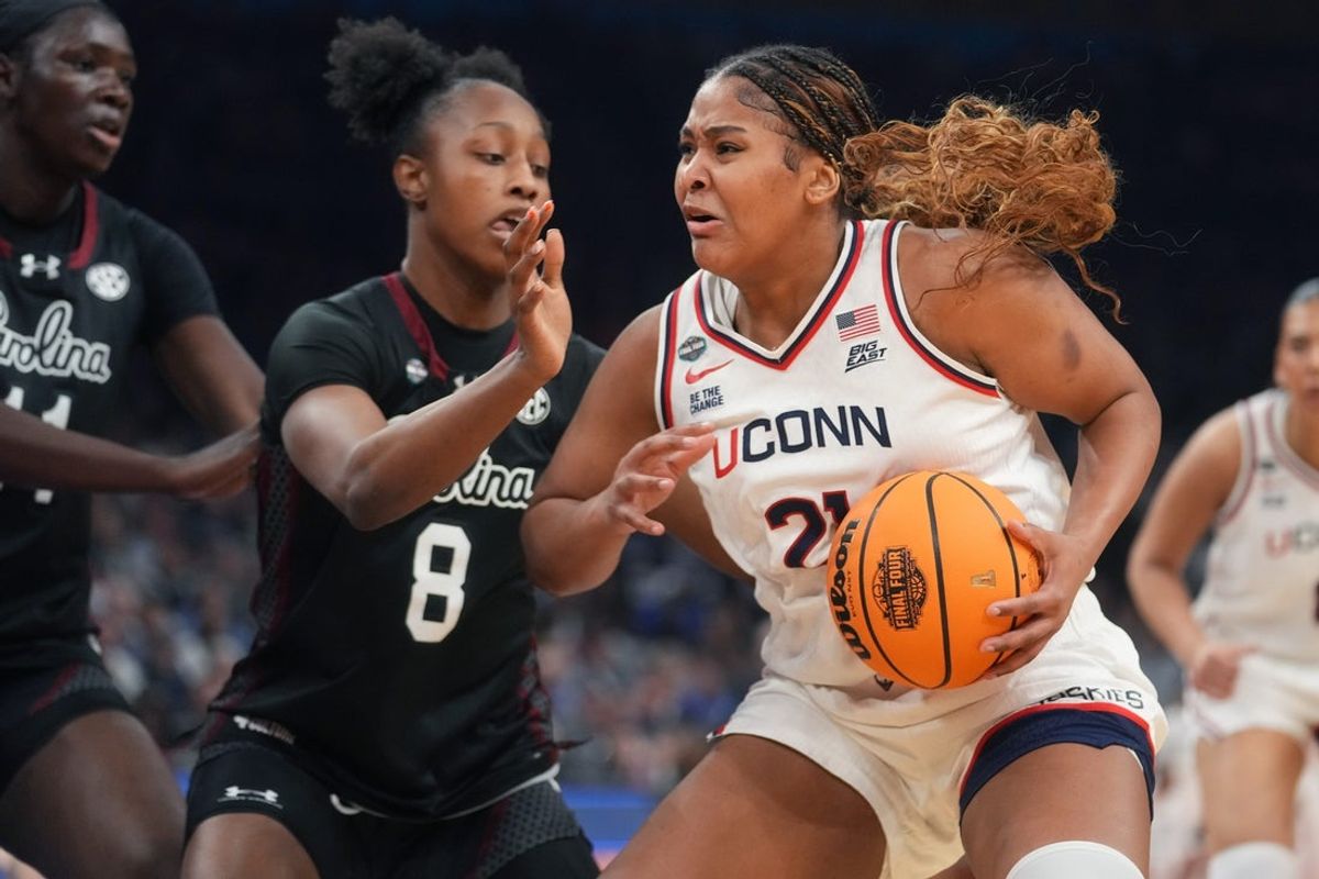 Connecticut Huskies forward Sarah Strong (21) drives in to the lane as South Carolina Gamecocks forward Joyce Edwards (8) defends during their NCAA Women's Final Four semifinal game at Mortgage Matchup Center on April 3, 2026.