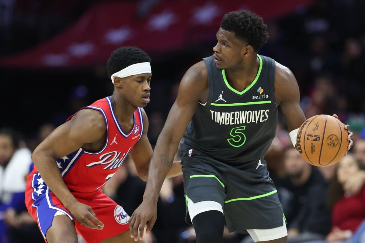 Apr 3, 2026; Philadelphia, Pennsylvania, USA; Minnesota Timberwolves guard Anthony Edwards (5) controls the ball against Philadelphia 76ers guard Vj Edgecombe (77) during the second quarter at Xfinity Mobile Arena. Mandatory Credit: Bill Streicher-Imagn Images