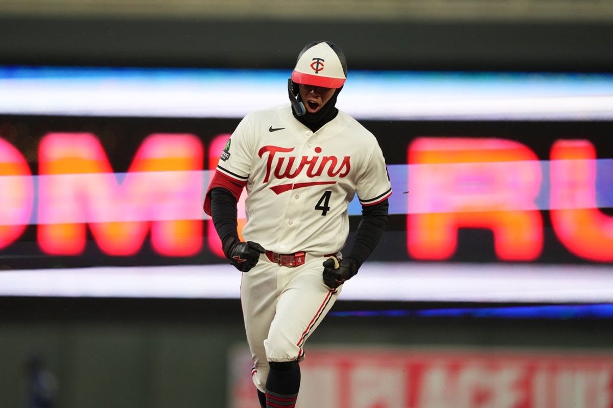Apr 3, 2026; Minneapolis, Minnesota, USA; Minnesota Twins shortstop Tristan Gray (4) hits a grand slam during the seventh inning against the Tampa Bay Rays at Target Field. Mandatory Credit: Jordan Johnson-Imagn Images