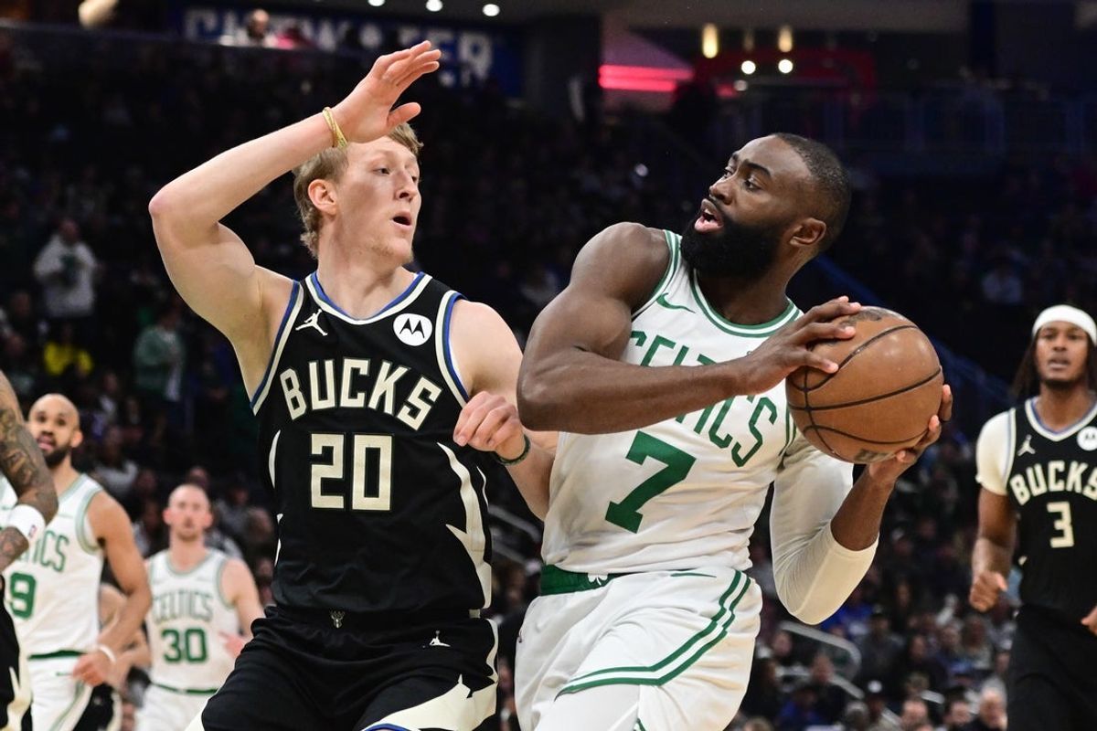 Apr 3, 2026; Milwaukee, Wisconsin, USA;  Boston Celtics forward Jaylen Brown (7) drives for the basket against Milwaukee Bucks guard AJ Green (20) in the first quarter at Fiserv Forum. Mandatory Credit: Benny Sieu-Imagn Images