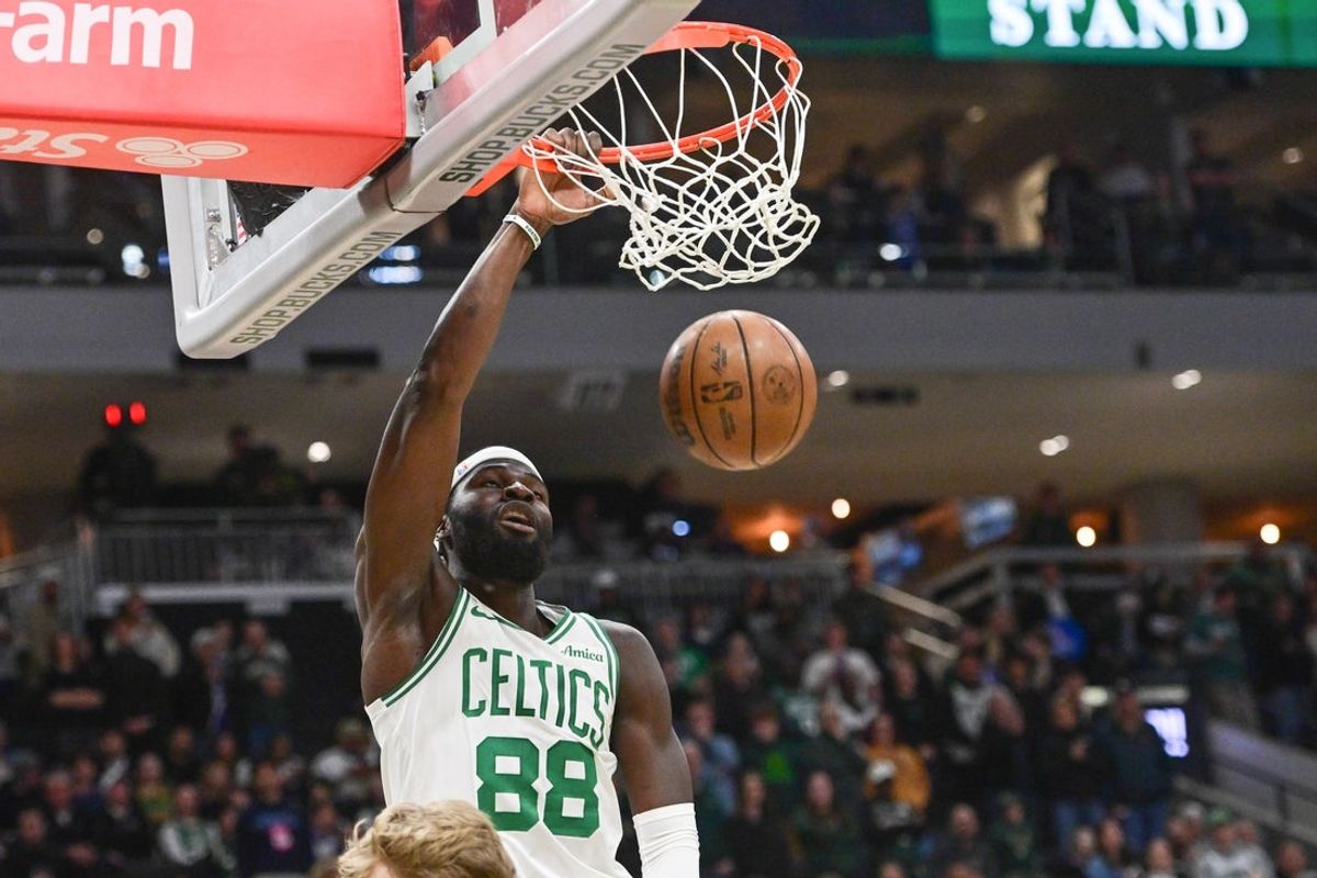 Apr 3, 2026; Milwaukee, Wisconsin, USA; Boston Celtics center Neemias Queta (88) dunks the ball against the Milwaukee Bucks in the first quarter at Fiserv Forum. Mandatory Credit: Benny Sieu-Imagn Images