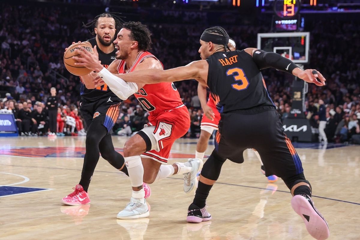 Apr 3, 2026; New York, New York, USA;  Chicago Bulls guard Tre Jones (30) looks to drive past New York Knicks guards Josh Hart (3) and Jalen Brunson (11) in the second quarter at Madison Square Garden. Mandatory Credit: Wendell Cruz-Imagn Images