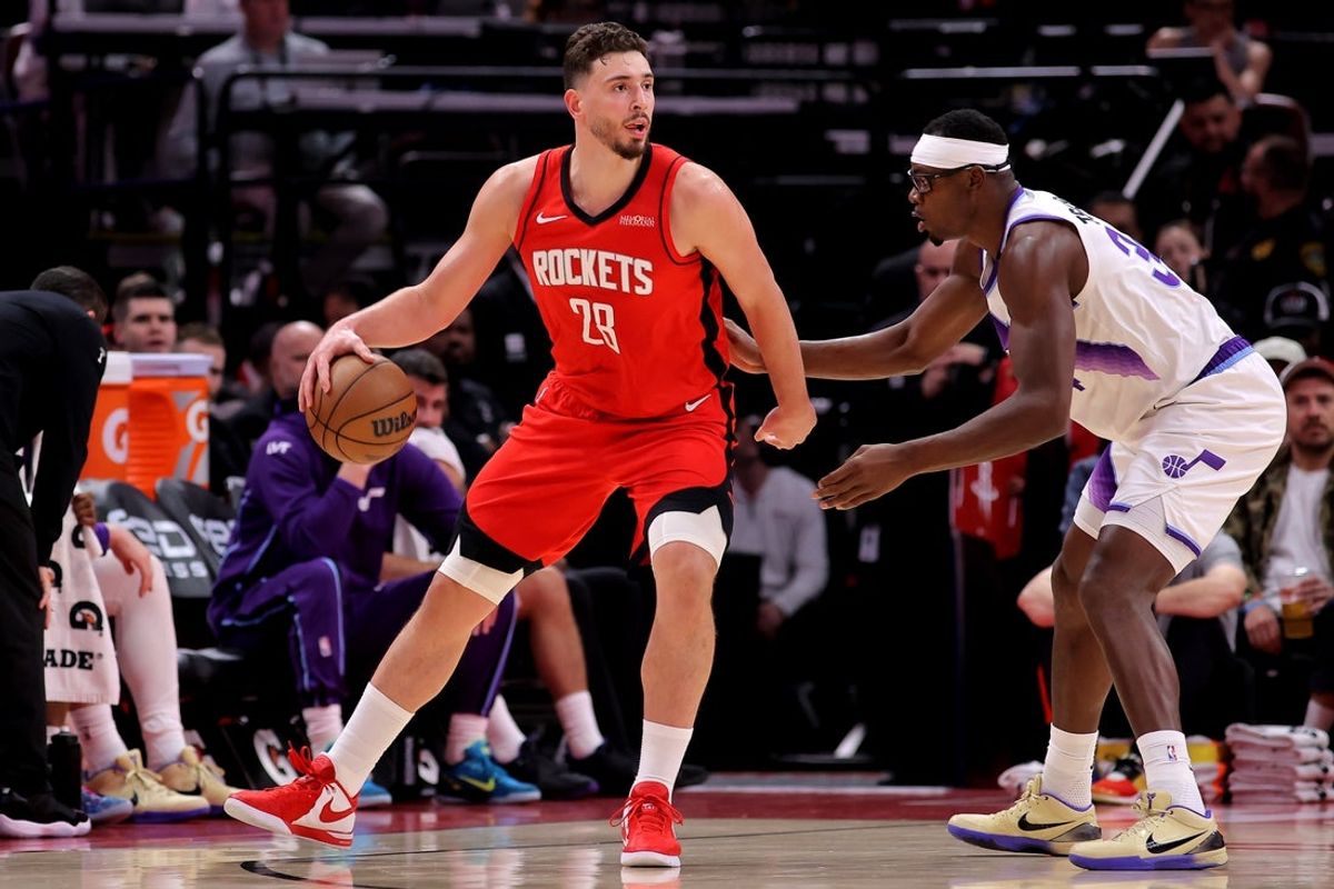 Apr 3, 2026; Houston, Texas, USA; Houston Rockets center Alperen Sengun (28) handles the ball against Utah Jazz center Oscar Tshiebwe (34) during the second quarter at Toyota Center. Mandatory Credit: Erik Williams-Imagn Images