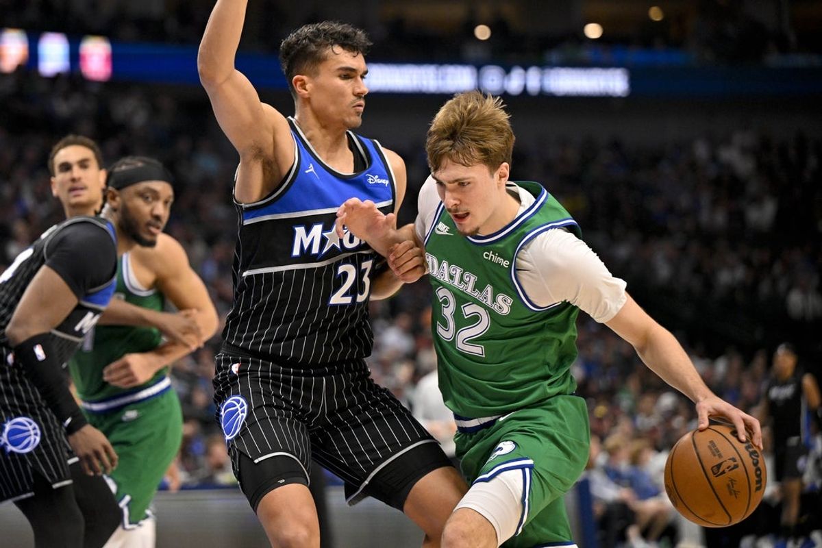 Apr 3, 2026; Dallas, Texas, USA; Dallas Mavericks forward Cooper Flagg (32) moves to the ball past Orlando Magic forward Tristan da Silva (23) during the first quarter at the American Airlines Center. Mandatory Credit: Jerome Miron-Imagn Images