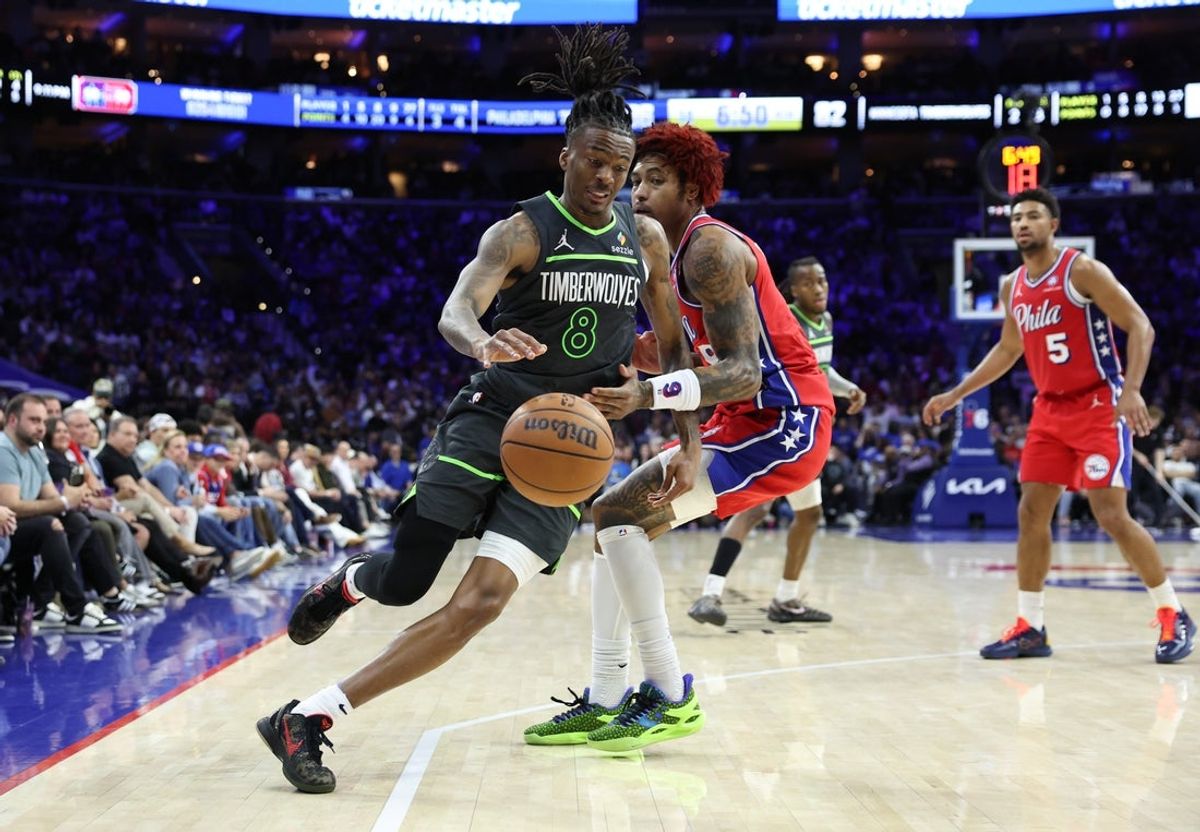 Apr 3, 2026; Philadelphia, Pennsylvania, USA; Minnesota Timberwolves guard Bones Hyland (8) dribbles] past Philadelphia 76ers guard Kelly Oubre Jr. (9) during the fourth quarter at Xfinity Mobile Arena. Mandatory Credit: Bill Streicher-Imagn Images