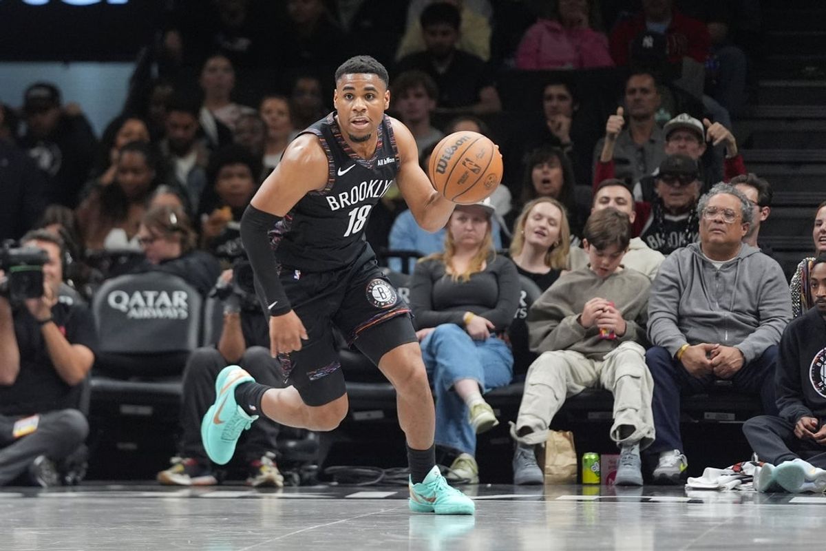 Apr 3, 2026; Brooklyn, New York, USA; Brooklyn Nets guard Malachi Smith (18) dribbles the ball up the court against the Atlanta Hawks during the first half at Barclays Center. Mandatory Credit: Gregory Fisher-Imagn Images