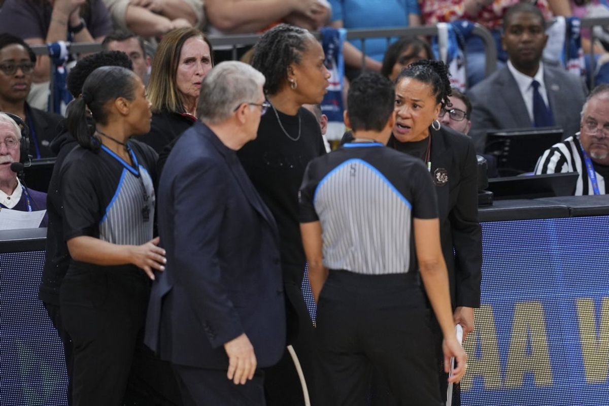 Apr 3, 2026; Phoenix, AZ, USA; UConn Huskies head coach Geno Auriemma and South Carolina Gamecocks head coach Dawn Staley argue at the end of a semifinal of the Final Four of the women's 2026 NCAA Tournament at Mortgage Matchup Center. Mandatory Credit: Joe Camporeale-Imagn Images
