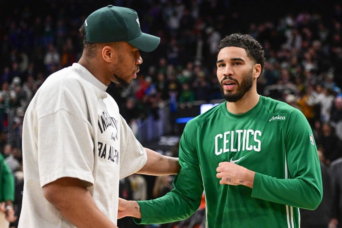 Apr 3, 2026; Milwaukee, Wisconsin, USA; Milwaukee Bucks forward Giannis Antetokounmpo (34) greets Boston Celtics forward Jayson Tatum (0) after the game at Fiserv Forum. Mandatory Credit: Benny Sieu-Imagn Images