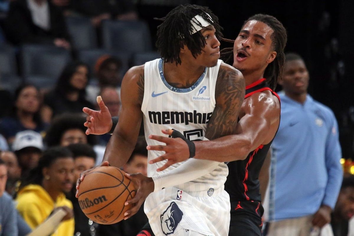 Apr 3, 2026; Memphis, Tennessee, USA; Memphis Grizzlies forward GG Jackson (45) handles the ball as Toronto Raptors forward Collin Murray-Boyles (12) defends during the third quarter at FedExForum. Mandatory Credit: Petre Thomas-Imagn Images