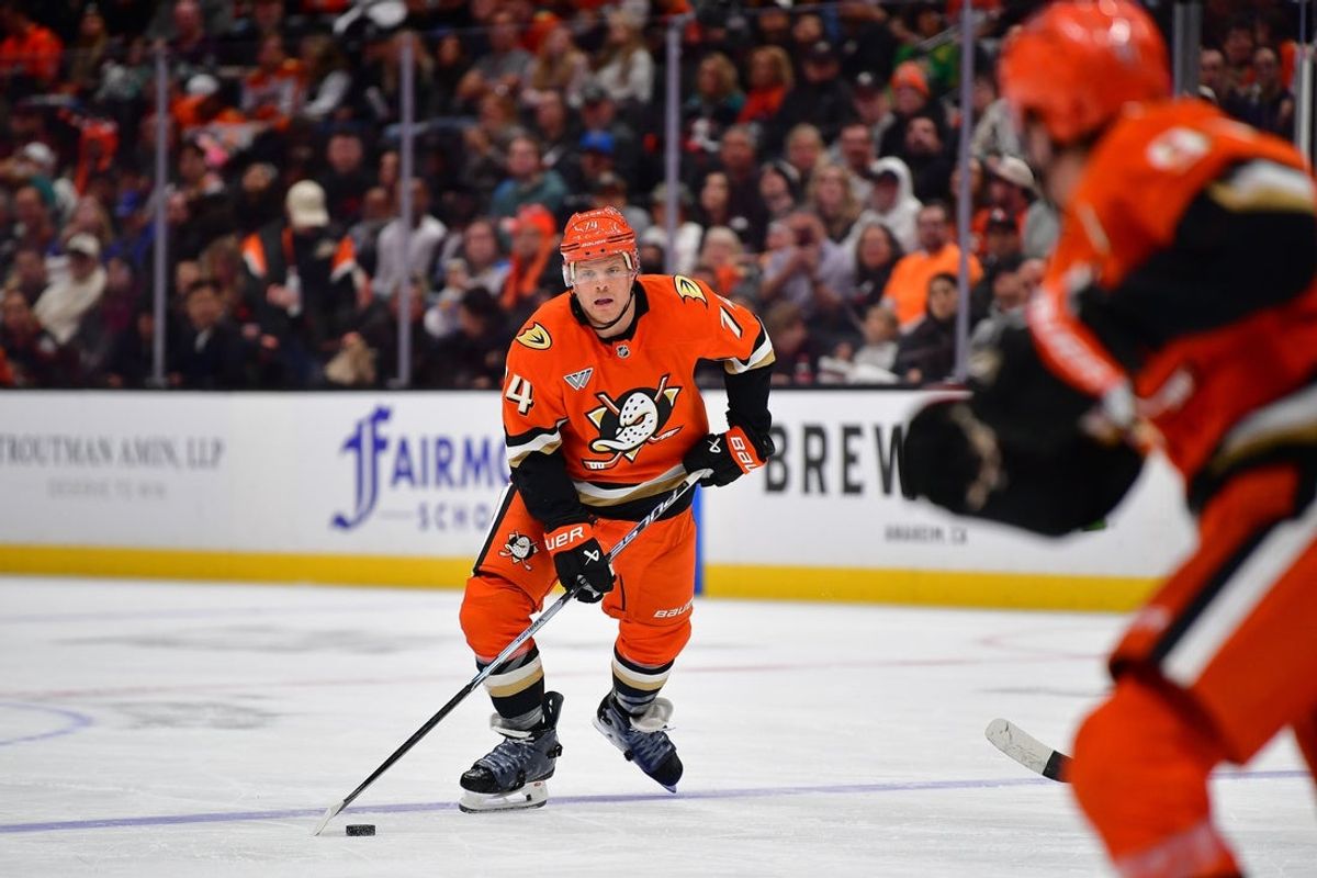 Apr 3, 2026; Anaheim, California, USA; Anaheim Ducks defenseman John Carlson (74) controls the puck against the St. Louis Blues during the second period at Honda Center. Mandatory Credit: Gary A. Vasquez-Imagn Images