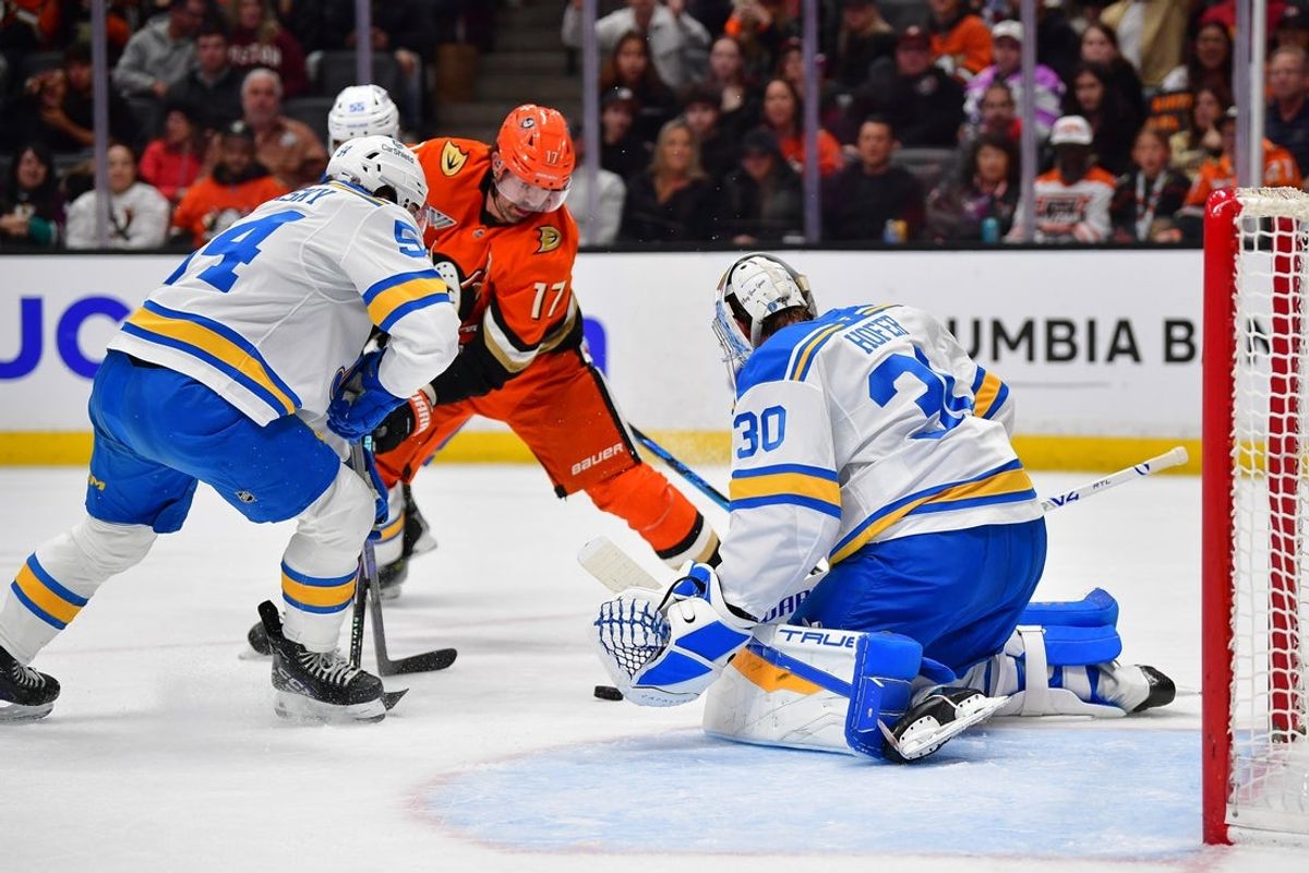 Apr 3, 2026; Anaheim, California, USA; St. Louis Blues right wing Dalibor Dvorsky (54) helps goaltender Joel Hofer (30) defend the goal against Anaheim Ducks left wing Alex Killorn (17) during the second period at Honda Center. Mandatory Credit: Gary A. Vasquez-Imagn Images