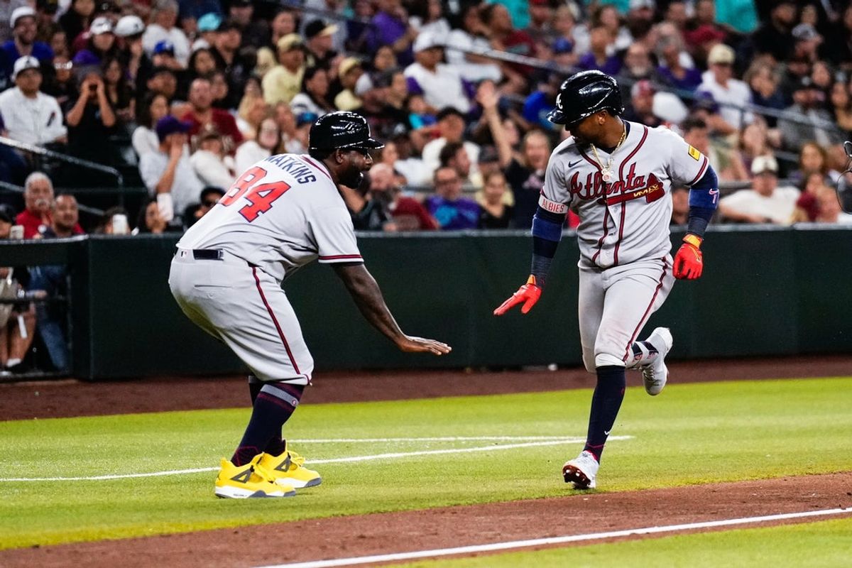 Apr 3, 2026; Phoenix, Arizona, USA; Atlanta Braves second baseman Ozzie Albies (1) celebrates his solo home run during the ninth inning of the game against the Arizona Diamondbacks at Chase Field. Mandatory Credit: Arianna Grainey-Imagn Images