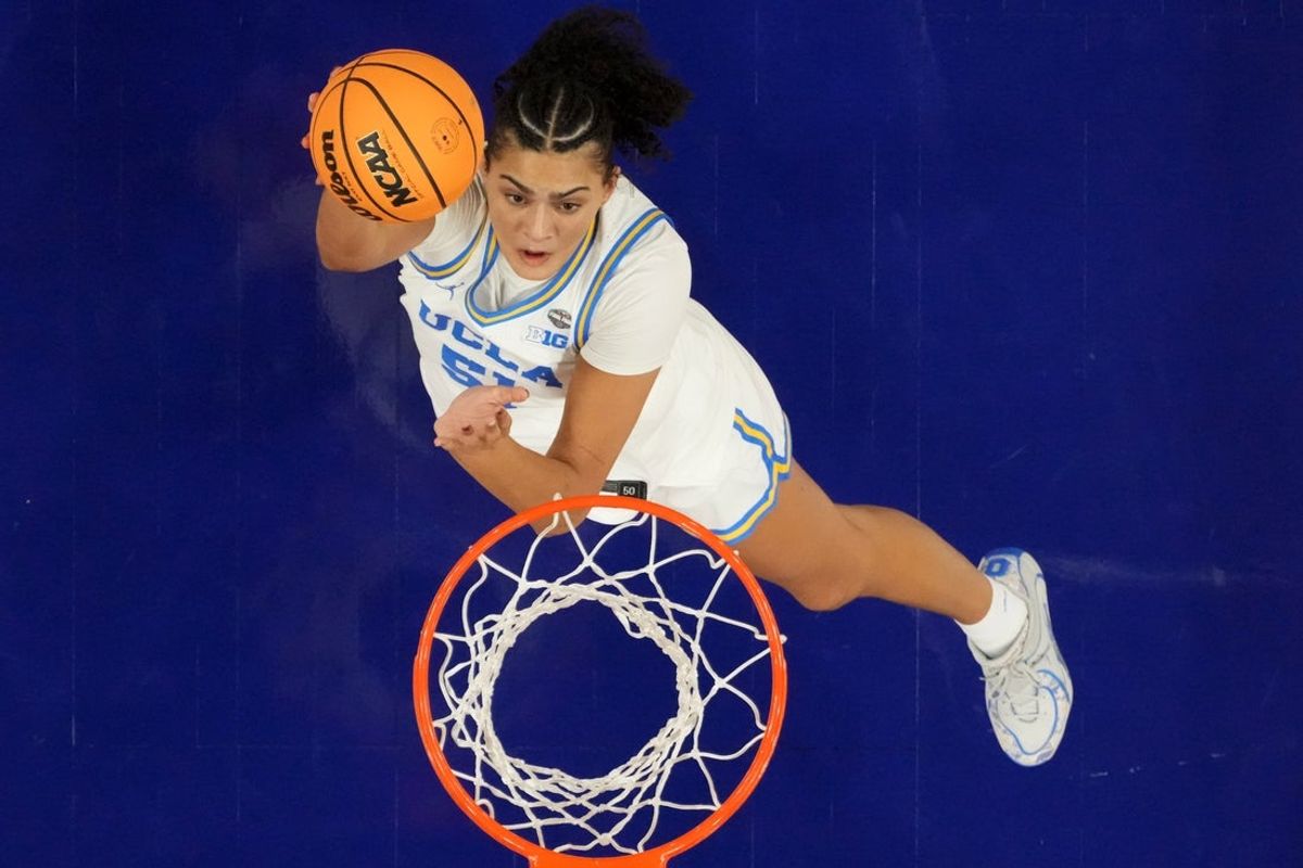 Apr 3, 2026; Phoenix, AZ, USA; UCLA Bruins center Lauren Betts (51) shoots the ball against the Texas Longhorns during a semifinal of the Final Four of the women's 2026 NCAA Tournament at Mortgage Matchup Center. Mandatory Credit: Kirby Lee-Imagn Images