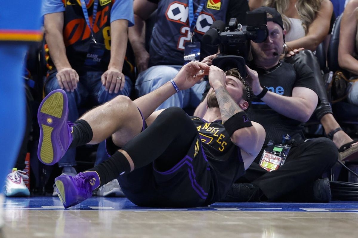 Apr 2, 2026; Oklahoma City, Oklahoma, USA; Los Angeles Lakers guard Luka Doncic (77) falls to the court after an injury against the Oklahoma City Thunder during the second half at Paycom Center. Mandatory Credit: Alonzo Adams-Imagn Images