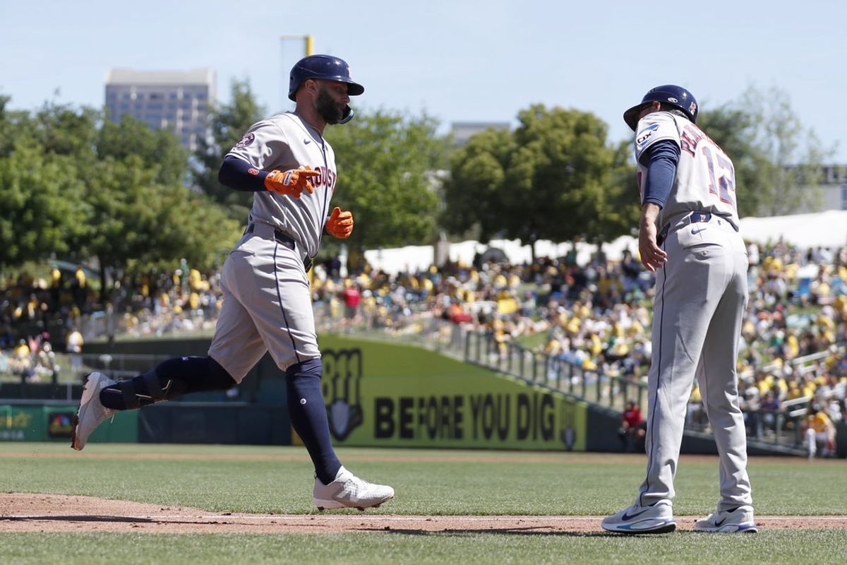 Apr 4, 2026; West Sacramento, California, USA; Houston Astros first baseman Christian Walker (8) celebrates with Houston Astros third base coach Tony Perezchica (12) after hitting a solo home run against the Athletics during the third inning at Sutter Health Park. Mandatory Credit: Scott Marshall-Imagn Images