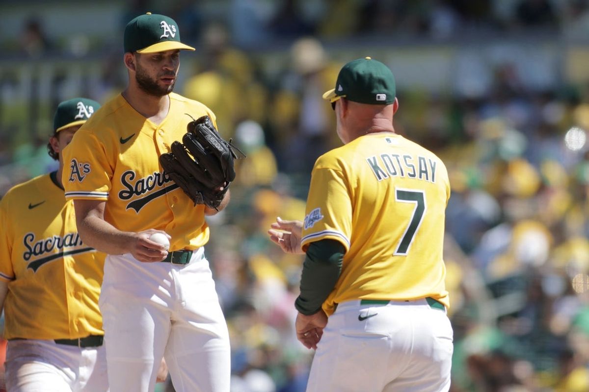 Apr 4, 2026; West Sacramento, California, USA; Athletics manager Mark Kotsay (7) pulls Athletics pitcher Luis Morales (19) out of the game during the fourth inning against the Houston Astros at Sutter Health Park. Mandatory Credit: Scott Marshall-Imagn Images
