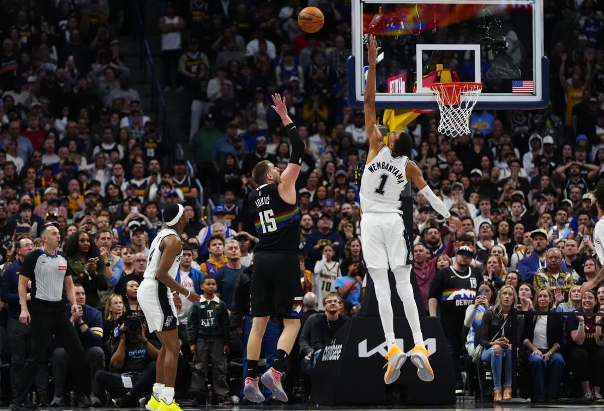 Apr 4, 2026; Denver, Colorado, USA; Denver Nuggets center Nikola Jokic (15) shoots the ball over San Antonio Spurs forward Victor Wembanyama (1) in overtime at Ball Arena. Mandatory Credit: Ron Chenoy-Imagn Images