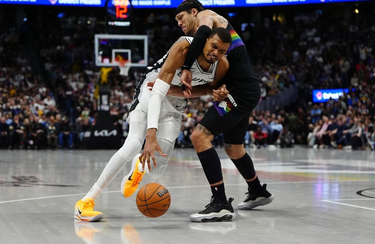 Apr 4, 2026; Denver, Colorado, USA; Denver Nuggets forward Aaron Gordon (32) defends on San Antonio Spurs forward Victor Wembanyama (1) in the fourth quarter at Ball Arena. Mandatory Credit: Ron Chenoy-Imagn Images