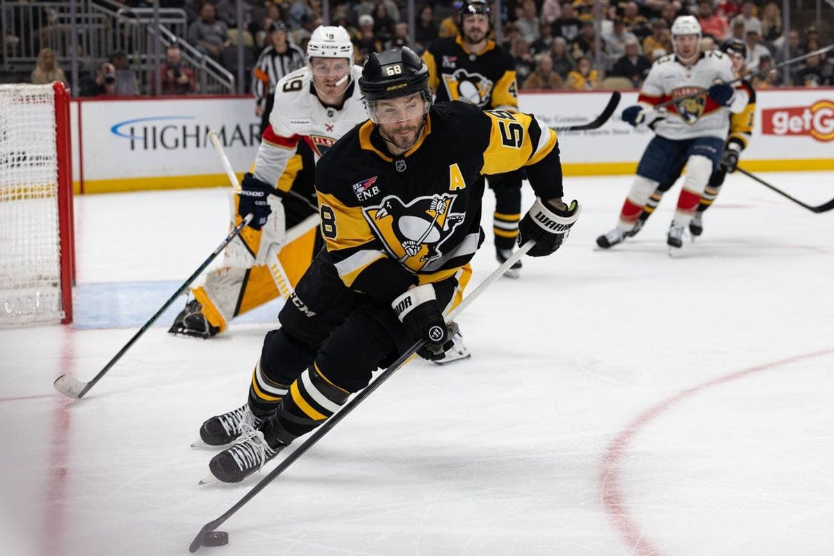 Apr 4, 2026; Pittsburgh, Pennsylvania, USA; Pittsburgh Penguins defenseman Kris Letang (58) controls the puck against the Florida Panthers during the second period at PPG Paints Arena. Mandatory Credit: Mark Alberti-Imagn Images