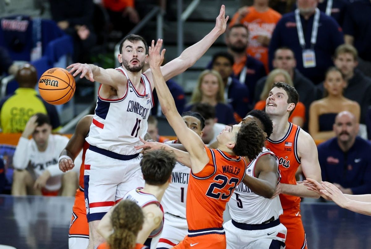 Apr 4, 2026; Indianapolis, IN, USA; UConn Huskies forward Alex Karaban (11) blocks a shot attempt from Illinois Fighting Illini guard Keaton Wagler (23) in the second half during a semifinal of the Final Four of the men's 2026 NCAA Tournament at Lucas Oil Stadium. Mandatory Credit: Trevor Ruszkowski-Imagn Images