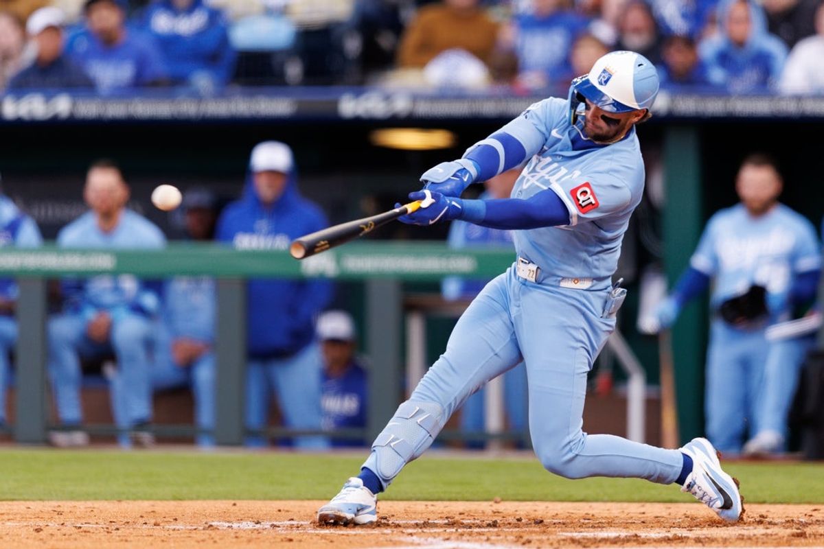 Apr 4, 2026; Kansas City, Missouri, USA; Kansas City Royals catcher Carter Jensen (22) hits a double during the second inning against the Milwaukee Brewers at Kauffman Stadium. Mandatory Credit: William Purnell-Imagn Images