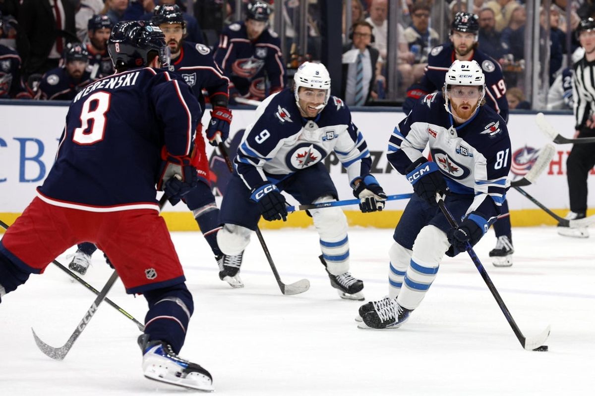 Apr 4, 2026; Columbus, Ohio, USA; Winnipeg Jets left wing Kyle Connor (81) looks to pass as Columbus Blue Jackets defenseman Zach Werenski (8) defends during the first period at Nationwide Arena. Mandatory Credit: Russell LaBounty-Imagn Images