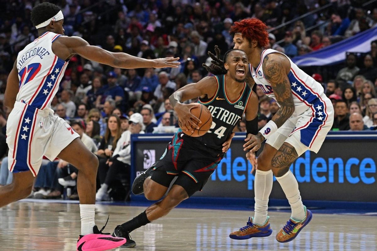 Apr 4, 2026; Philadelphia, Pennsylvania, USA; Detroit Pistons guard Daniss Jenkins (24) is fouled by Philadelphia 76ers guard Kelly Oubre Jr. (9) during the first half at Xfinity Mobile Arena. Mandatory Credit: Eric Hartline-Imagn Images