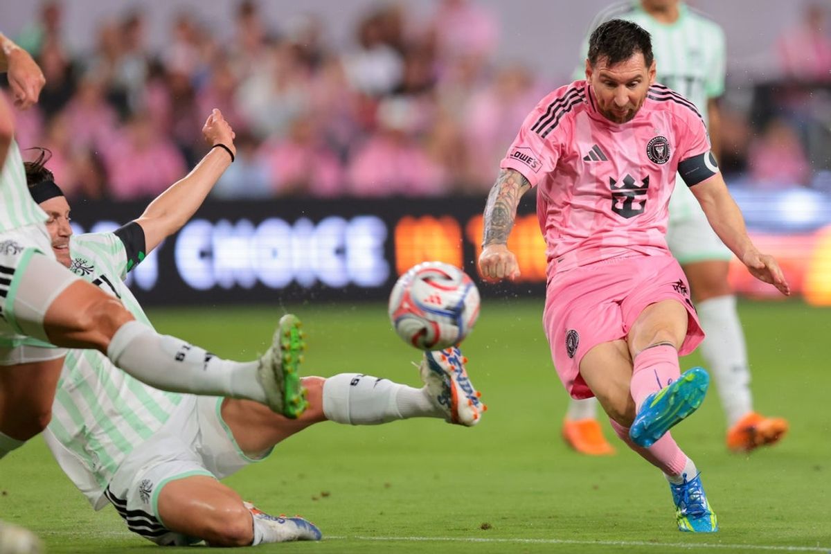 Apr 4, 2026; Miami, Florida, USA; Inter Miami CF forward Lionel Messi (10) kicks the ball against Austin FC during the first half at Nu Stadium. Mandatory Credit: Sam Navarro-Imagn Images