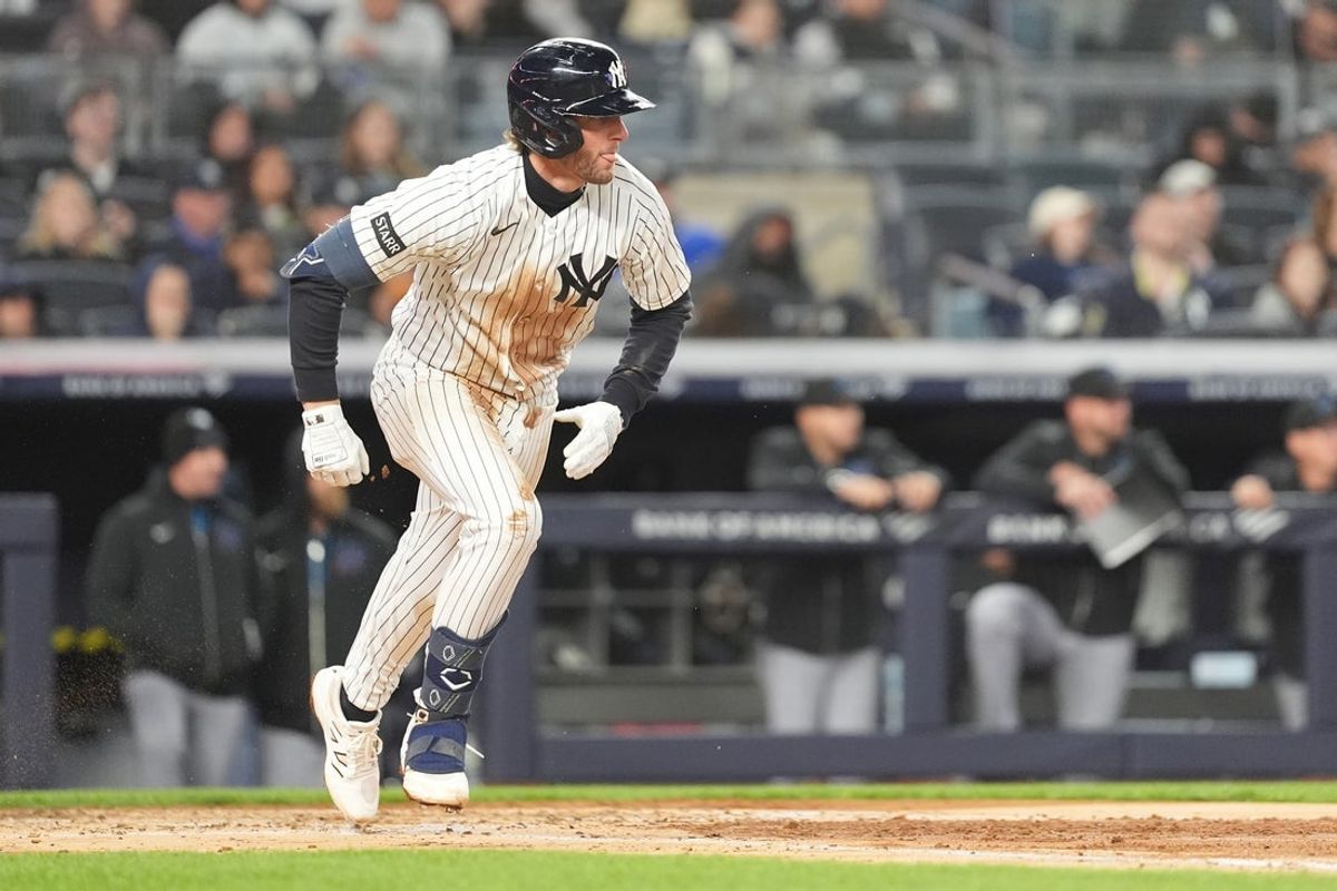 Apr 4, 2026; Bronx, New York, USA; New York Yankees third baseman Ryan McMahon (19) runs out a ground ball and is safe on a fielding error by the Miami Marlins during the third inning at Yankee Stadium. Mandatory Credit: Gregory Fisher-Imagn Images