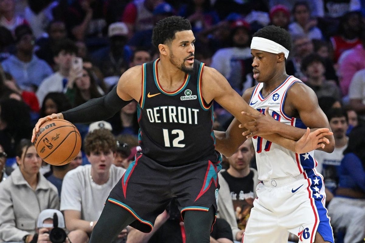 Apr 4, 2026; Philadelphia, Pennsylvania, USA; Detroit Pistons forward Tobias Harris (12) is defended by Philadelphia 76ers guard Vj Edgecombe (77) during the second half at Xfinity Mobile Arena. Mandatory Credit: Eric Hartline-Imagn Images