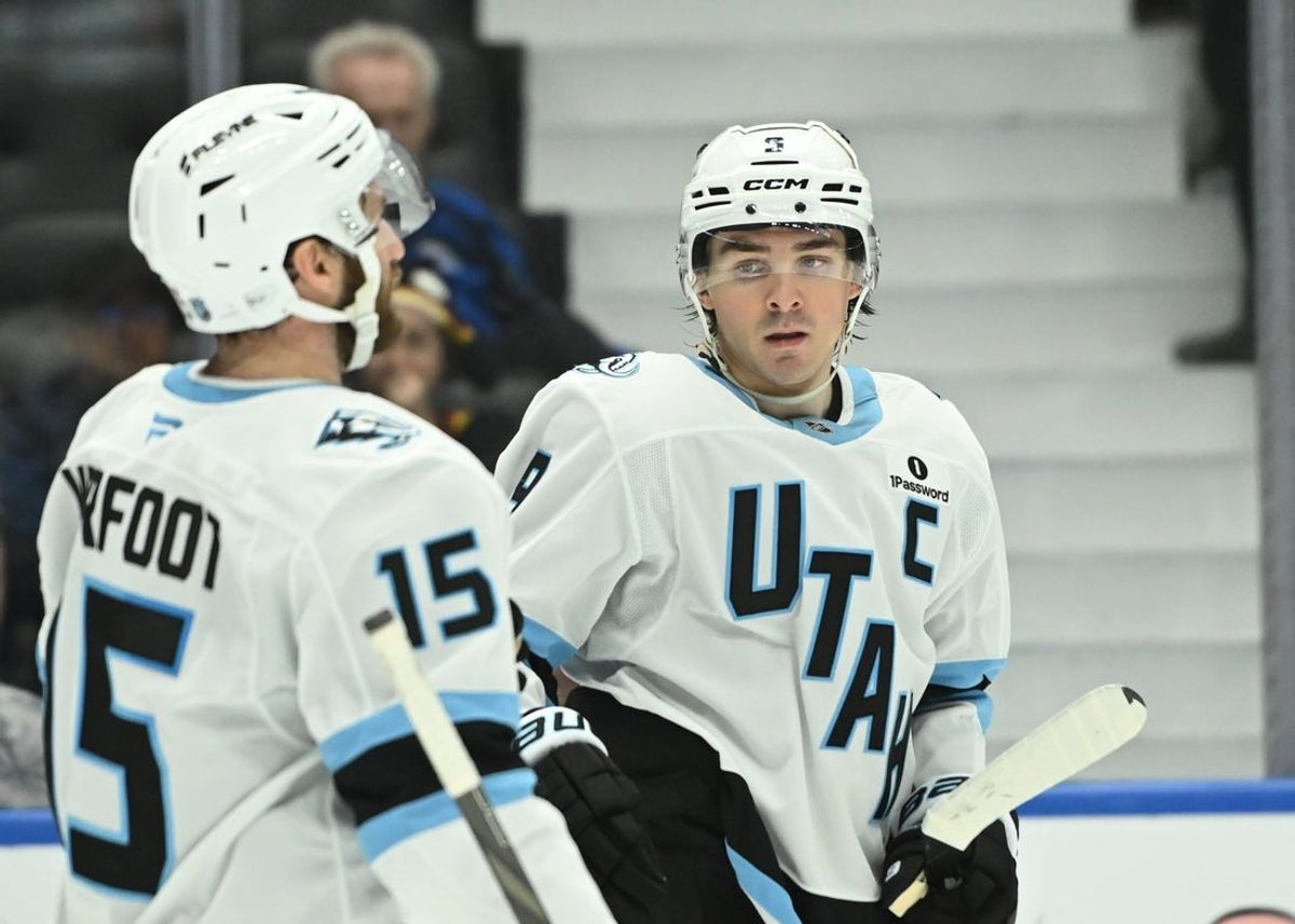 Apr 4, 2026; Vancouver, British Columbia, CAN; Utah Mammoth right wing Clayton Keller (9) celebrates his empty net goal with team mate, center Alexander Kerfoot (15) during the third period at Rogers Arena. Mandatory Credit: Simon Fearn-Imagn Images