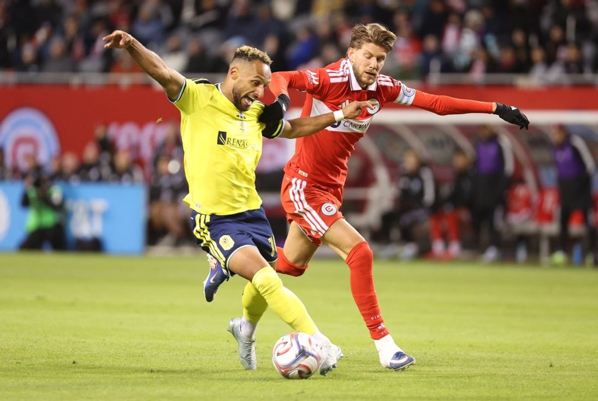 Apr 4, 2026; Chicago, Illinois, USA; Nashville SC forward Hany Mukhtar (10) and Chicago Fire FC midfielder Anton Saletros (6) battle for control of the ball during the second half at Soldier Field. Mandatory Credit: Talia Sprague-Imagn Images