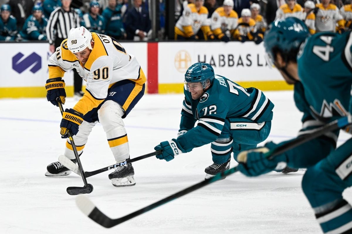 Apr 4, 2026; San Jose, California, USA; Nashville Predators center Ryan O'Reilly (90) controls the puck against San Jose Sharks left winger William Eklund (72) in the first period at SAP Center at San Jose. Mandatory Credit: Eakin Howard-Imagn Images