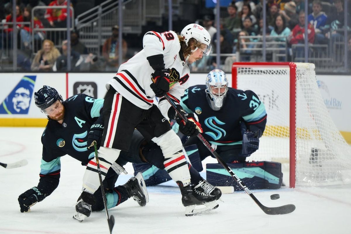 Apr 4, 2026; Seattle, Washington, USA; Chicago Blackhawks left wing Tyler Bertuzzi (59) plays thep puck during the first period against the Seattle Kraken at Climate Pledge Arena. Mandatory Credit: Steven Bisig-Imagn Images
