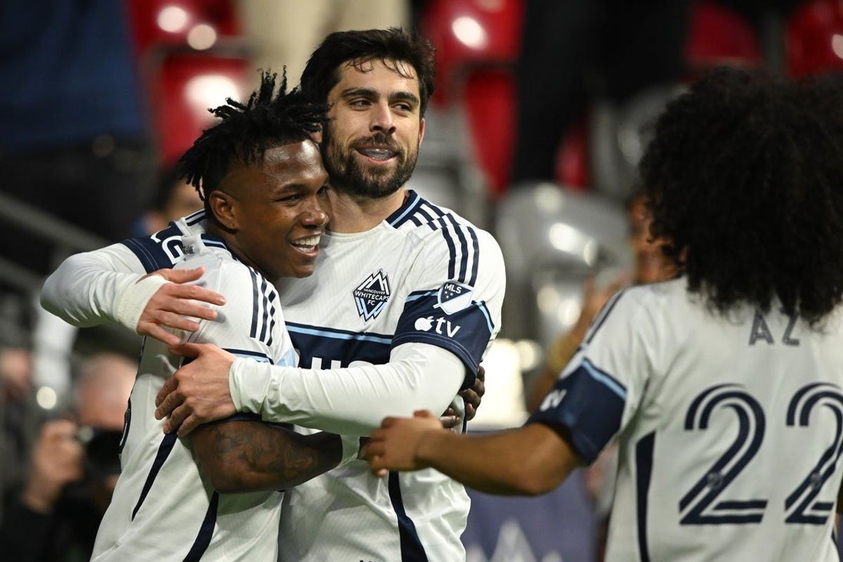 Apr 4, 2026; Vancouver, British Columbia, CAN;  Vancouver Whitecaps FC defender Edier Ocampo (18) celebrates scoring with forward Brian White (24) during the first half against the Portland Timbers at BC Place. Mandatory Credit: Anne-Marie Sorvin-Imagn Images