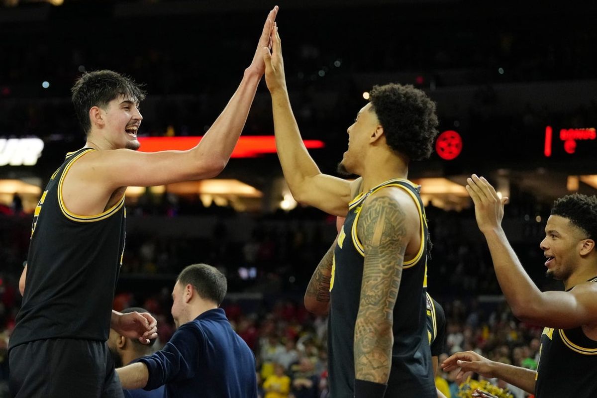 Apr 4, 2026; Indianapolis, IN, USA; Michigan Wolverines center Aday Mara (15) high fives forward Yaxel Lendeborg (23) during the second half in a semifinal of the Final Four of the men's 2026 NCAA Tournament at Lucas Oil Stadium. Mandatory Credit: Bob Donnan-Imagn Images
