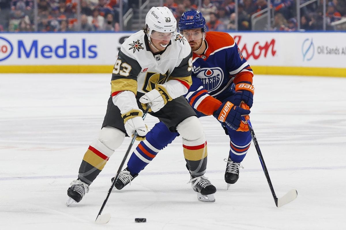 Apr 4, 2026; Edmonton, Alberta, CAN; Vegas Golden Knights forward Mitch Marner (93)  looks to make a pass in front of Edmonton Oilers forward Jack Roslovic (28) during the second period at Rogers Place. Mandatory Credit: Perry Nelson-Imagn Images