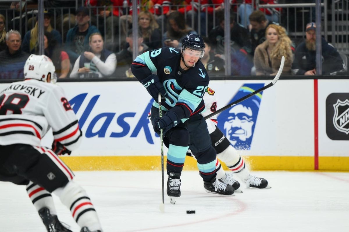 Apr 4, 2026; Seattle, Washington, USA; Seattle Kraken defenseman Vince Dunn (29) plays the puck during the third period against the Chicago Blackhawks at Climate Pledge Arena. Mandatory Credit: Steven Bisig-Imagn Images
