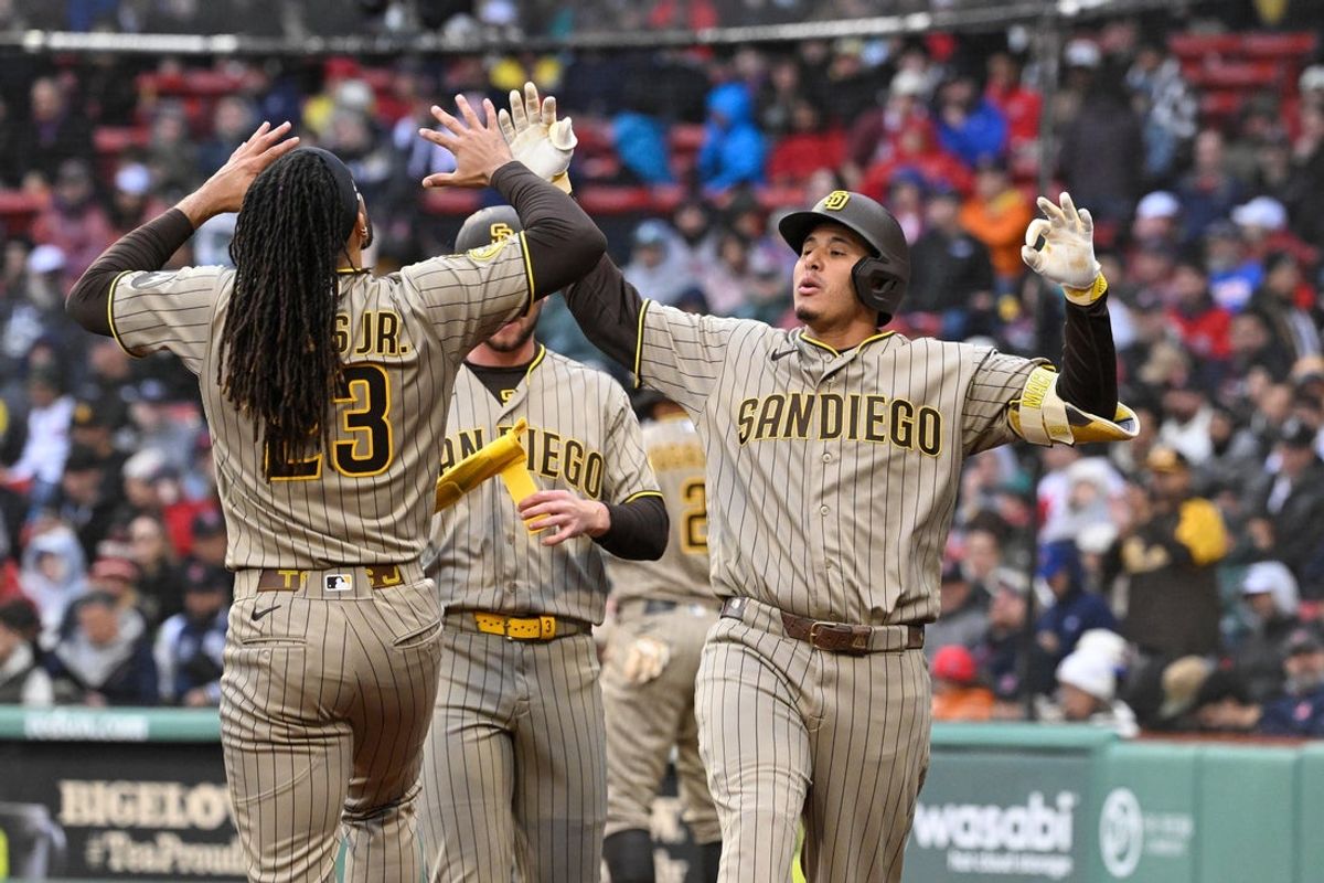 Apr 5, 2026; Boston, Massachusetts, USA; San Diego Padres third baseman Manny MacHado (13) celebrates his three run home run against the Boston Red Sox with /right fielder Fernando Tatis Jr. (23) during the fifth inning at Fenway Park. Mandatory Credit: Eric Canha-Imagn Images