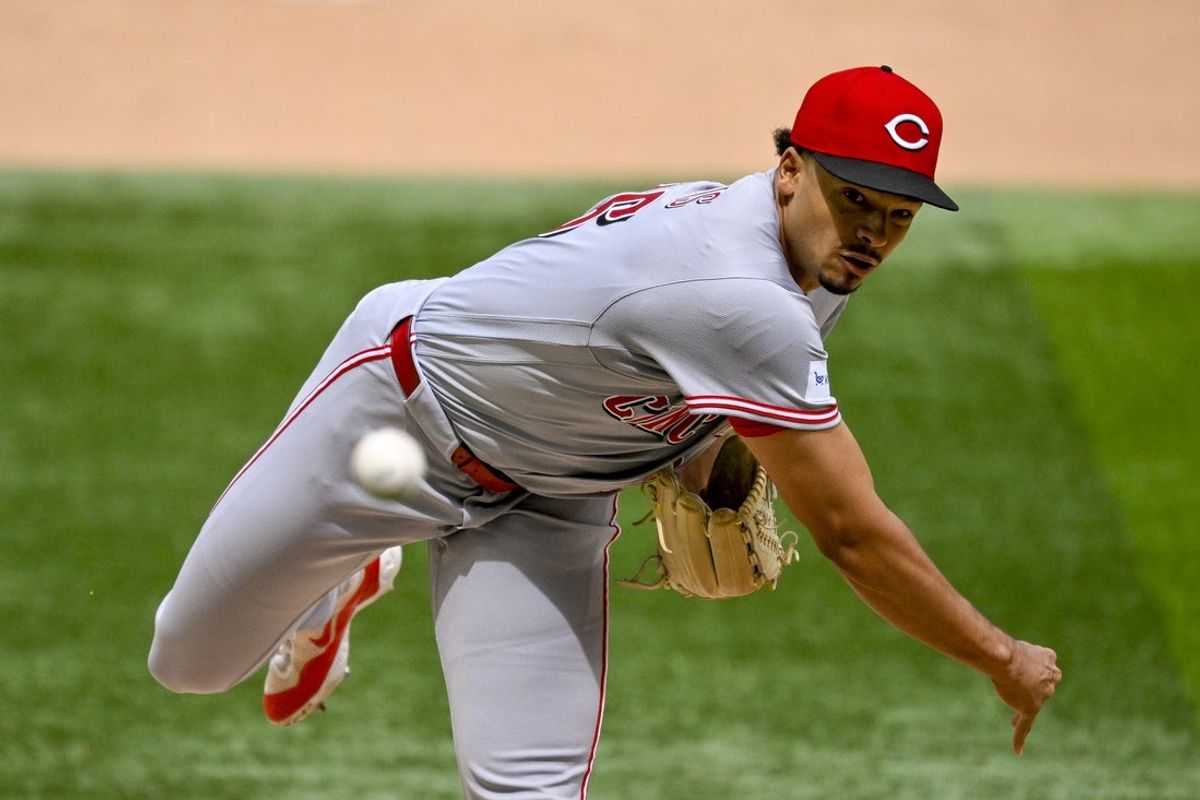 Apr 5, 2026; Arlington, Texas, USA; Cincinnati Reds starting pitcher Chase Burns (26) pitches against the Texas Rangers during the fifth inning at Globe Life Field. Mandatory Credit: Jerome Miron-Imagn Images