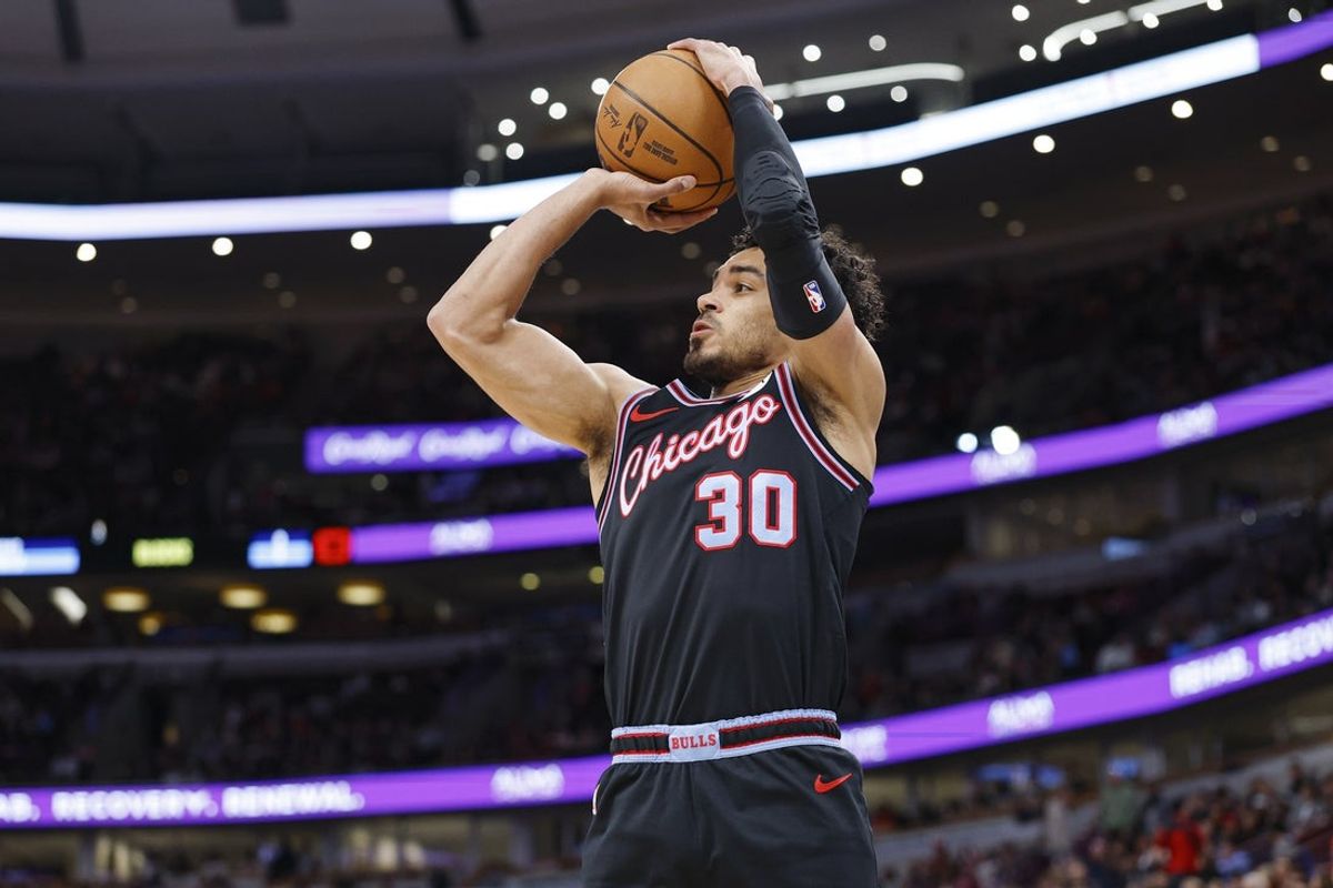 Apr 5, 2026; Chicago, Illinois, USA; Chicago Bulls guard Tre Jones (30) shoots against the Phoenix Suns during the first half at United Center. Mandatory Credit: Kamil Krzaczynski-Imagn Images