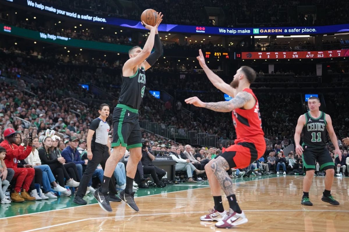 Apr 5, 2026; Boston, Massachusetts, USA;  Boston Celtics center Nikola Vucevic (4) shoots a jump shot against the Toronto Raptors during the first half at TD Garden. Mandatory Credit: Gregory Fisher-Imagn Images
